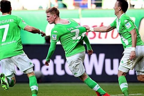 Wolfsburg's Belgian midfielder Kevin De Bruyne (C) celebrates his team's first goal with Wolfsburg's midfielder Daniel Caligiuri (L) and Wolfsburg's Croatian midfielder Ivan Perisic (R) during the German first division Bundesliga football match VfL Wolfsburg vs FC Schalke 04 in Wolfsburg, central Germany, on April 19, 2015. AFP PHOTO / RONNY HARTMANN

RESTRICTIONS - DFL RULES TO LIMIT THE ONLINE USAGE DURING MATCH TIME TO 15 PICTURES PER MATCH. IMAGE SEQUENCES TO SIMULATE VIDEO IS NOT ALLOWED AT ANY TIME. FOR FURTHER QUERIES PLEASE CONTACT DFL DIRECTLY AT + 49 69 650050.        (Photo credit should read RONNY HARTMANN/AFP/Getty Images)