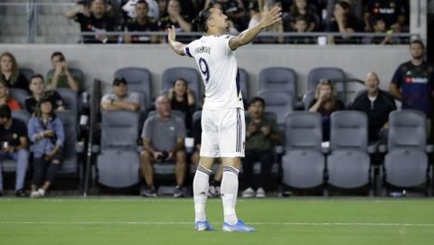 Los Angeles Galaxy's Zlatan Ibrahimovic (9) celebrates after scoring against Los Angeles FC during the first half of an MLS soccer match Sunday, Aug. 25, 2019, in Los Angeles. (AP Photo/Marcio Jose Sanchez)