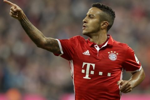 Bayern's Thiago celebrates after scoring his side's second goal during the German Bundesliga soccer match between FC Bayern Munich and Hertha BSC at the Allianz Arena stadium in Munich, Germany, Wednesday, Sept. 21, 2016. (AP Photo/Matthias Schrader)