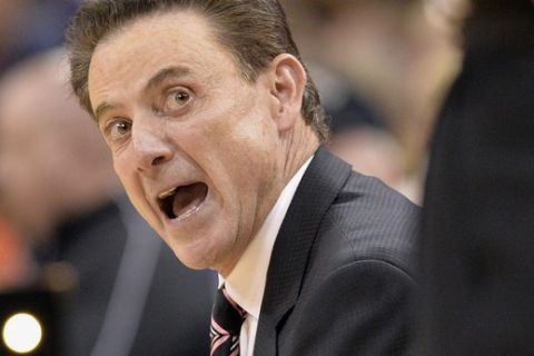 Louisville head coach Rick Pitino argues with an official during the first half of an NCAA college basketball game against Evansville, Friday, Nov. 11, 2016, in Louisville Ky. (AP Photo/Timothy D. Easley)