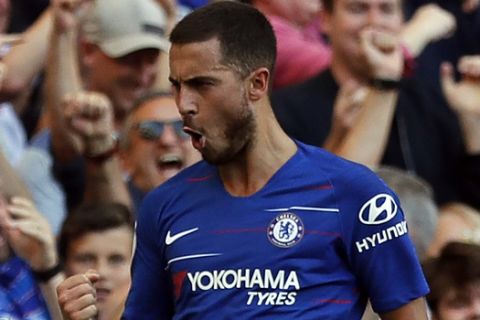 Chelsea's Eden Hazard celebrates after scoring his side's second goal during the English Premier League soccer match between Chelsea and Bournemouth at Stamford Bridge stadium in London, Saturday, Sept. 1, 2018.(AP Photo/Frank Augstein)