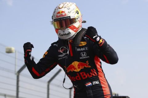 Red Bull driver Max Verstappen of the Netherlands celebrates after winning the 70th Anniversary Formula One Grand Prix at the Silverstone circuit, Silverstone, England, Sunday, Aug. 9, 2020. (Bryn Lennon, Pool via AP)