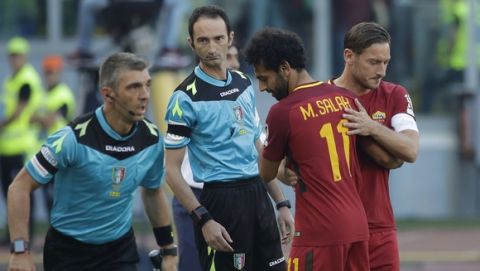 Roma Francesco Totti, right, enters the field for Mohamed Salah during an Italian Serie A soccer match between Roma and Genoa at the Olympic stadium in Rome, Sunday, May 28, 2017. Francesco Totti is playing his final match with Roma against Genoa after a 25-season career with his hometown club. (AP Photo/Alessandra Tarantino)