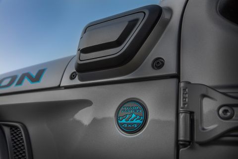 The charge port on the 2021 Jeep® Wrangler 4xe is mounted on the left cowl. The charge port is covered with a push open/push close door.