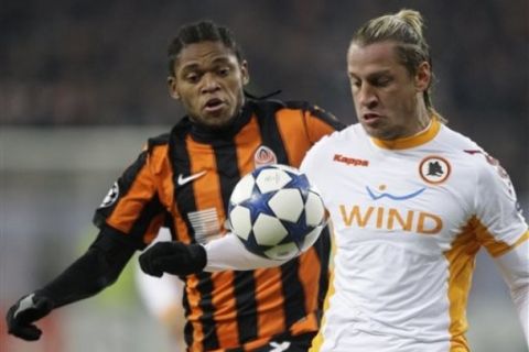 AS Roma's Rodrigo Philippe Mexes, right, and Shakhtar Donetsk's Luiz Adriano of Brazil in action during a Champions League, round of 16, second leg soccer match between AS Roma and Shakhtar Donetsk in Donetsk, Ukraine, Tuesday, March 8, 2011. (AP Photo/Efrem Lukatsky)