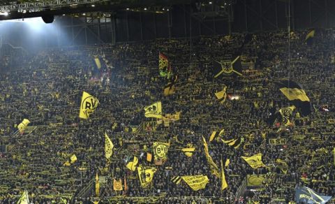 Dortmund fans cheer before the Champions League group A soccer match between Borussia Dortmund and Atletico Madrid at the BVB stadium in Dortmund, Germany, Wednesday, Oct. 24, 2018. (AP Photo/Martin Meissner)
