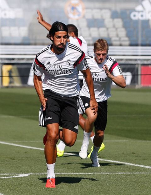 MADRID, SPAIN - AUGUST 07:  Sami Khedira (L) and Toni Kroos of Real Madrid run during a training session at Valdebebas training ground on August 7, 2014 in Madrid, Spain.  (Photo by Antonio Villalba/Real Madrid via Getty Images)