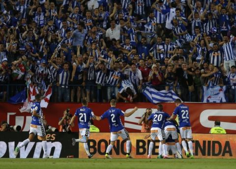 Alaves' players celebrate after Theo Hernandez scored a goal against Barcelona during the Copa del Rey final soccer match between Barcelona and Alaves at the Vicente Calderon stadium in Madrid, Spain, Saturday May 27, 2017. (AP Photo/Daniel Ochoa de Olza)
