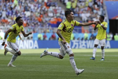 Colombia's Juan Quintero celebrates after scoring his side's first goal during the group H match between Colombia and Japan at the 2018 soccer World Cup in the Mordavia Arena in Saransk, Russia, Tuesday, June 19, 2018. (AP Photo/Natacha Pisarenko)