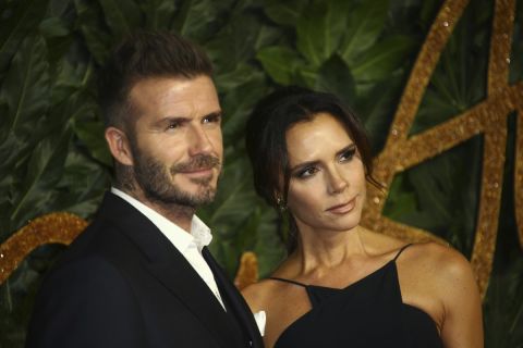 Former soccer player David Beckham, left, and designer Victoria Beckham pose for photographers upon arrival at the The Fashion Awards 2018 in central London, Monday, Dec. 10, 2018. (Photo by Joel C Ryan/Invision/AP)