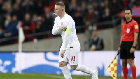 England's Wayne Rooney comes on for his 120th cap during the international friendly soccer match between England and the United States at Wembley stadium, Thursday, Nov. 15, 2018. (AP Photo/Alastair Grant)