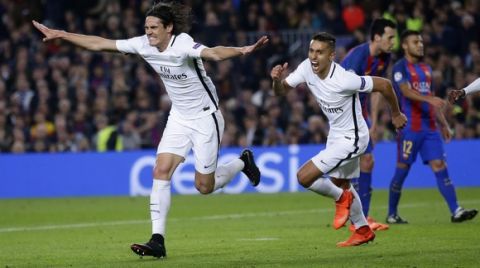 PSG's Edinson Cavani celebrates scoring his side's 1st goal during the Champions League round of 16, second leg soccer match between FC Barcelona and Paris Saint Germain at the Camp Nou stadium in Barcelona, Spain, Wednesday March 8, 2017. (AP Photo/Manu Fernandez)