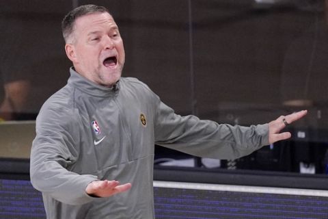 Denver Nuggets head coach Michael Malone yells to his players during the second half of an NBA conference final playoff basketball game against the Los Angeles Lakers Thursday, Sept. 24, 2020, in Lake Buena Vista, Fla. (AP Photo/Mark J. Terrill)