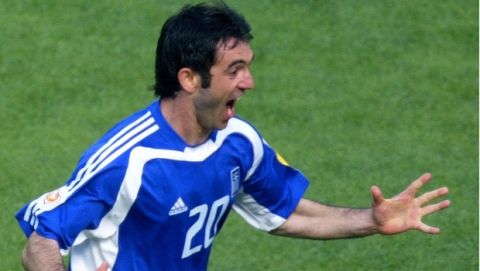 Georgios Karagounis of Greece celebrates after he scored against Portugal during their Euro 2004, Group A, soccer match at the Dragao stadium in Porto, Portugal, Saturday June 12, 2004. Greece won the match 2-1. Other teams in group A are Spain and Russia. (AP Photo/Murad Sezer)