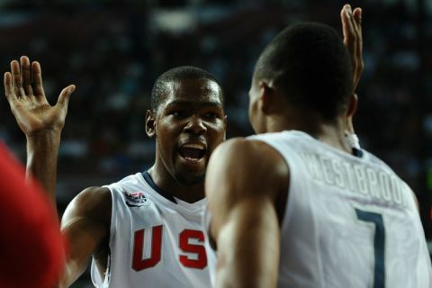 US Kevin Durant (L) and US Russell Westbrook react to play  during a World Cup Championship quarter final basketball match US versus Russia in Istanbul on September 9, 2010. AFP PHOTO / FRANCK FIFE (Photo credit should read FRANCK FIFE/AFP/Getty Images)