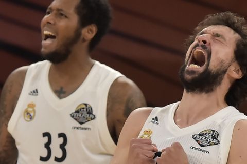 Madrid's Sergio Llull, right, and Madrid's Trey Thompkins react during the Euroleague Final Four semifinal basketball match between CSKA Moscow and Real Madrid at the Fernando Buesa Arena in Vitoria, Spain, Friday, May 17, 2019. (AP Photo/Alvaro Barrientos)