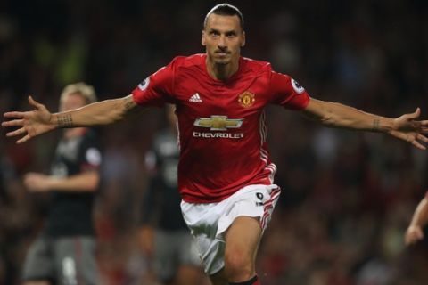 MANCHESTER, ENGLAND - AUGUST 19: Zlatan Ibrahimovic of Manchester United celebrates after scoring a goal to make it 2-0 during the Premier League match between Manchester United and  Southampton at Old Trafford on August 19, 2016 in Manchester, England. (Photo by Matthew Ashton - AMA/Getty Images)