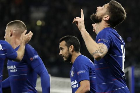 Chelsea's Oliver Giroud celebrates after scoring a goal during the Europa League Group L soccer match between Chelsea and PAOK at Stamford Bridge stadium, in London, Thursday, Nov. 29, 2018. (AP Photo/Matt Dunham)