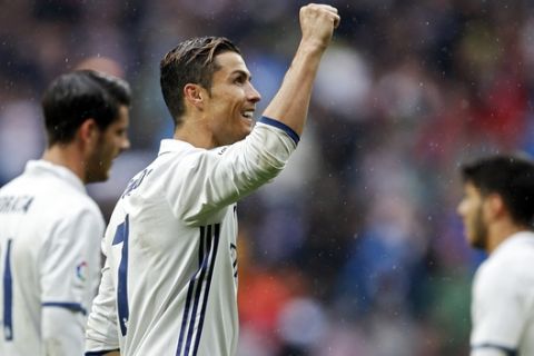 Real Madrid's Cristiano Ronaldo celebrates at the end of the Spanish La Liga soccer match between Real Madrid and Valencia at the Santiago Bernabeu stadium in Madrid, Saturday, April 29, 2017. Ronaldo scored once in the Real Madrid's 2-1 victory. (AP Photo/Francisco Seco)