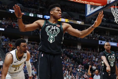 Milwaukee Bucks forward Giannis Antetokounmpo reacts after being called for a foul on Denver Nuggets guard Jamal Murray during the second half of an NBA basketball game Sunday, April 1, 2018, in Denver. The Nuggets won 128-125 in overtime. (AP Photo/David Zalubowski)