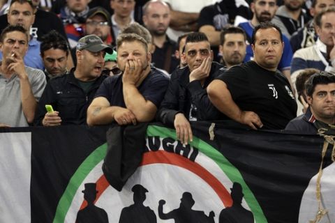 Juventus fans watch a Serie A soccer match between Roma and Juventus, at Rome's Olympic stadium, Sunday, May 14, 2017. (AP Photo/Gregorio Borgia)