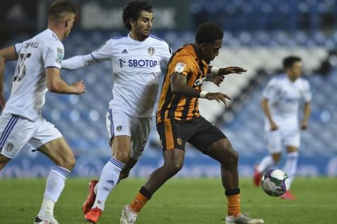 Hulls' Mallik Wilks, right controls the ball during the English League Cup soccer match between Leeds United and Hull in Leeds, England, Wednesday, Sept. 16, 2020. (Oli Scarf/Pool via AP)
