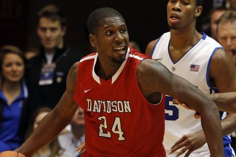 Davidson's De'Mon Brooks (24) looks to pass the ball during the second half of an NCAA college basketball game against the Duke in Durham, N.C., Friday, Nov. 8, 2013. (AP Photo/Karl B DeBlaker)