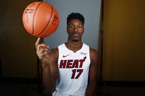 Miami Heat's Kyle Alexander (17) poses during the NBA basketball team's media day, Monday, Sept. 30, 2019, in Miami. (AP Photo/Brynn Anderson)