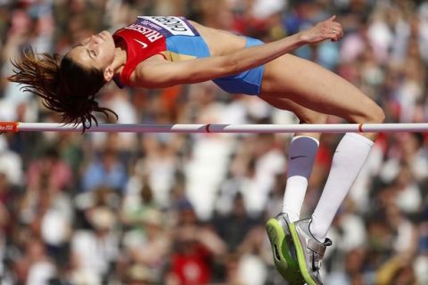 Russia's Anna Chicherova competes in a women's high jump qualification round during the athletics in the Olympic Stadium at the 2012 Summer Olympics, London, Thursday, Aug. 9, 2012. (AP Photo/Matt Dunham)