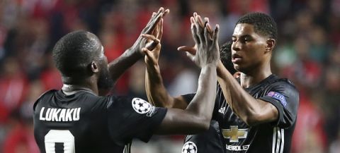 Manchester United's Marcus Rashford, right, celebrates his goal with his teammate Romelu Lukaku against Benfica during their Champions League group A soccer match between Manchester United and Benfica at Benfica's Luz stadium in Lisbon, Wednesday, Oct. 18, 2017. (AP Photo/Armando Franca)