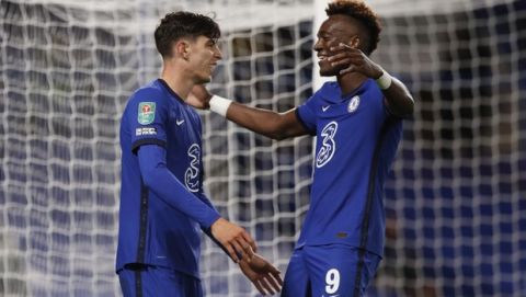 Chelsea's Kai Havertz, left, celebrates with his teammate Tammy Abraham, after scoring for the third time during the English League Cup third round soccer match between Chelsea and Barnsley at Stamford Bridge in London, Wednesday, Sept. 23, 2020. (AP Photo/Alastair Grant)