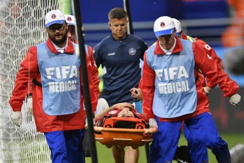 Denmark's William Kvist is carried on a stretcher after getting injury during the group C match between Peru and Denmark at the 2018 soccer World Cup in the Mordovia Arena in Saransk, Russia, Saturday, June 16, 2018. (AP Photo/Martin Meissner)