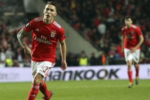 Benfica's Alex Grimaldo celebrates after scoring his side's third goal during the Europa League round of 16, second leg, soccer match between Benfica and Dinamo Zagreb at the Luz stadium in Lisbon, Thursday, March 14, 2019. (AP Photo/Armando Franca)
