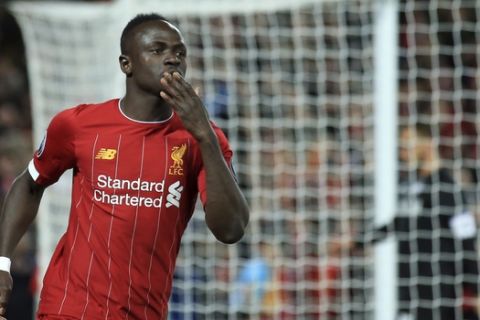 Liverpool's Sadio Mane celebrates after scoring his side's opening goal during the Champions League group E soccer match between Liverpool and Red Bull Salzburg at Anfield stadium in Liverpool, England, Wednesday, Oct. 2, 2019. (AP Photo/Jon Super)