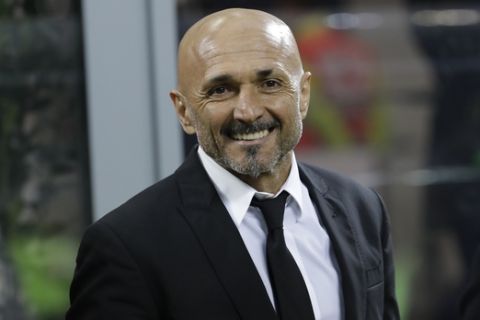 Roma coach Luciano Spalletti smiles prior to an Italian Serie A soccer match between Inter Milan and Roma, at the San Siro stadium in Milan, Italy, Sunday, Feb. 26, 2017. (AP Photo/Luca Bruno)
