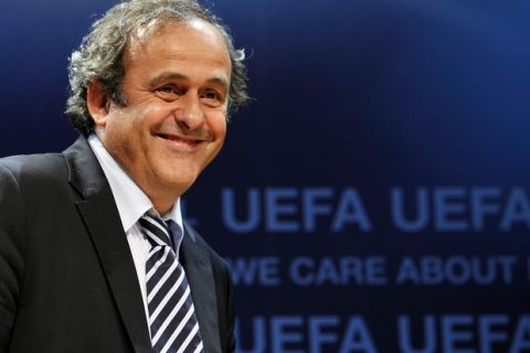 UEFA president Michel Platini smiles as he arrives at a press conference following an executive board meeting at the European football's goaverning body headquarters on June 16, 2011 in Nyon. Platini announced that the Champions League final will take place at London's Wembley Stadium in 2013, for the second time in three years, due to "the "exceptional circumstances" of the Football Association's 150th anniversary. Platini also announced that Toulouse and Saint-Etienne would host matches at the 2016 European Championship in France, having initially been placed on the reserve list.  AFP PHOTO / FABRICE COFFRINI
