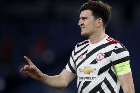Manchester United's Harry Maguire gestures during the Europa League semifinal, second leg soccer match between Roma and Manchester United at Rome's Olympic stadium, Italy, Thursday, May 6, 2021. (AP Photo/Alessandra Tarantino)