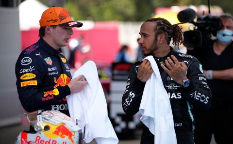Mercedes driver Lewis Hamilton of Britain talks with second placed Red Bull driver Max Verstappen of the Netherlands, left, after winning the Spanish Formula One Grand Prix at the Barcelona Catalunya racetrack in Montmelo, just outside Barcelona, Spain, Sunday, May 9, 2021. (AP Photo/Emilio Morenatti, Pool)