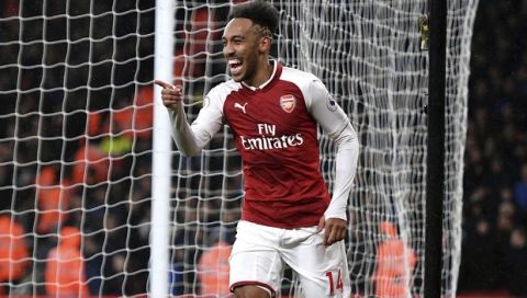Arsenals's Pierre-Emerick Aubameyang celebrates after scoring his side's fourth goal of the game during their English Premier League soccer match against Everton at the Emirates Stadium, London, Saturday, Feb. 3, 2018. (Victoria Jones/PA via AP)