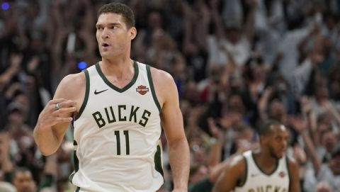 Milwaukee Bucks' Brook Lopez reacts to his three-point basket during the second half of Game 1 of the NBA Eastern Conference basketball playoff finals against the Toronto Raptors Wednesday, May 15, 2019, in Milwaukee. The Bucks won 108-100 to take a 1-0 lead in the series. (AP Photo/Morry Gash)