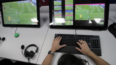 A referee demonstrates a video operation room (VOR), a facility of the Video Assistant Referee (VAR) system which will be rolled out for the first time during the World Cup, at the 2018 World Cup International Broadcast Centre in Moscow, Russia, Saturday, June 9, 2018. (AP Photo/Dmitri Lovetsky)