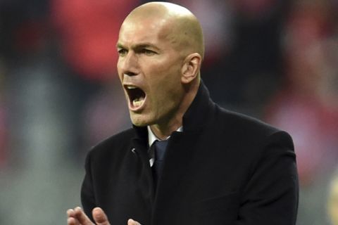 Real Madrid's coach Zinedine Zidane shouts during the Champions League quarterfinal first leg soccer match between FC Bayern Munich and Real Madrid, in Munich, Germany, Wednesday, April 12, 2017. (Andreas Gebert/dpa via AP)