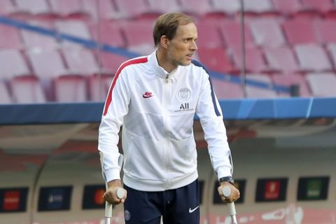 PSG's head coach Thomas Tuchel arrives on the pitch for a training session at the Luz stadium in Lisbon, Saturday Aug. 22, 2020. PSG will play Bayern Munich in the Champions League final soccer match on Sunday. (Miguel A. Lopes/Pool via AP)