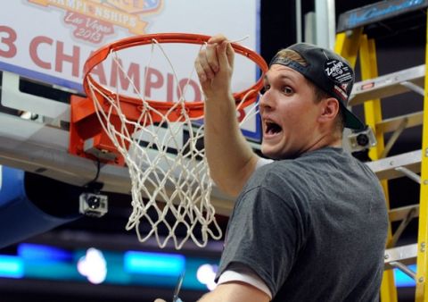 LAS VEGAS, NV - MARCH 11:  Przemek Karnowski #24 of the Gonzaga Bulldogs cuts the net after the Bulldogs defeated the Saint Mary's Gaels 65-51 in the championship game of the West Coast Conference Basketball tournament at the Orleans Arena March 11, 2013 in Las Vegas, Nevada.  (Photo by David Becker/Getty Images)