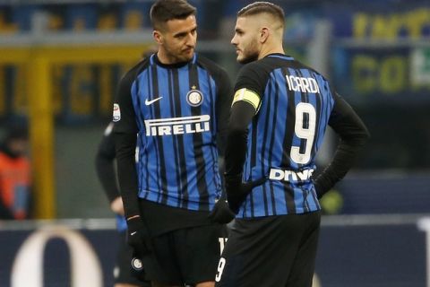 Inter Milan's Mauro Icardi, right, stands with his teammate Matias Vecino after Antonin Barak scored his side's third goal during the Serie A soccer match between Inter Milan and Udinese at the San Siro stadium in Milan, Italy, Saturday, Dec. 16, 2017. (AP Photo/Antonio Calanni)