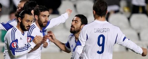 Cypriot player George Efrem (3R) celebrates scoring a goal with teammates during their Euro 2016 Group B qualifying match against Andorra at the GSP Stadium in the capital Nicosia on November 16, 2014. AFP PHOTO / SAKIS SAVIDES        (Photo credit should read SAKIS SAVIDES/AFP/Getty Images)