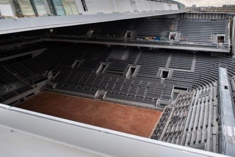 The construction work of the newly built roof of the Philippe Chatrier center court is pictured Wednesday Feb.5, 2020 at the Roland Garros stadium. The French Open venue becomes the last of the four Grand Slam venues to install a retractable roof on their main show court. ( Martin Bureau/Pool via AP)
