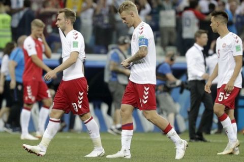 Danish players leave the pitch after the round of 16 match between Croatia and Denmark at the 2018 soccer World Cup in the Nizhny Novgorod Stadium, in Nizhny Novgorod, Russia, Sunday, July 1, 2018. Croatia eliminates Denmark 3-2 on penalties after game ends 1-1. (AP Photo/Gregorio Borgia)