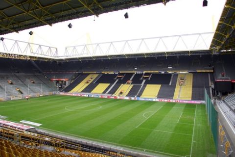 Interior view of the empty stadium of the German first division soccer club Borussia Dortmund  in Dortmund, Germany, Monday, Oct. 24, 2005. The stadium has a total seating capacity of 60,285 and is hosting six matches - including one semifinal - of the Soccer World Cup 2006 in Germany. (AP Photo/Michael Sohn)