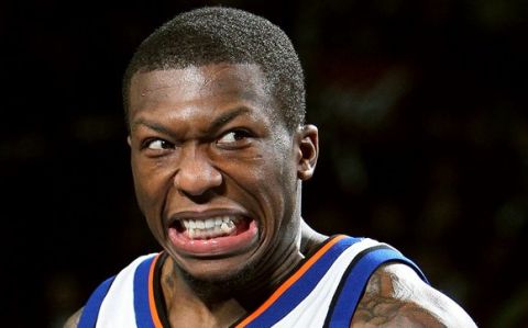 DALLAS - FEBRUARY 13:  Nate Robinson #2 of the New York Knicks reacts during the trophy presentation after his third win during the Sprite Slam Dunk Contest on All-Star Saturday Night, part of 2010 NBA All-Star Weekend at American Airlines Center on February 13, 2010 in Dallas, Texas. NOTE TO USER: User expressly acknowledges and agrees that, by downloading and or using this photograph, User is consenting to the terms and conditions of the Getty Images License Agreement.  (Photo by Jed Jacobsohn/Getty Images)